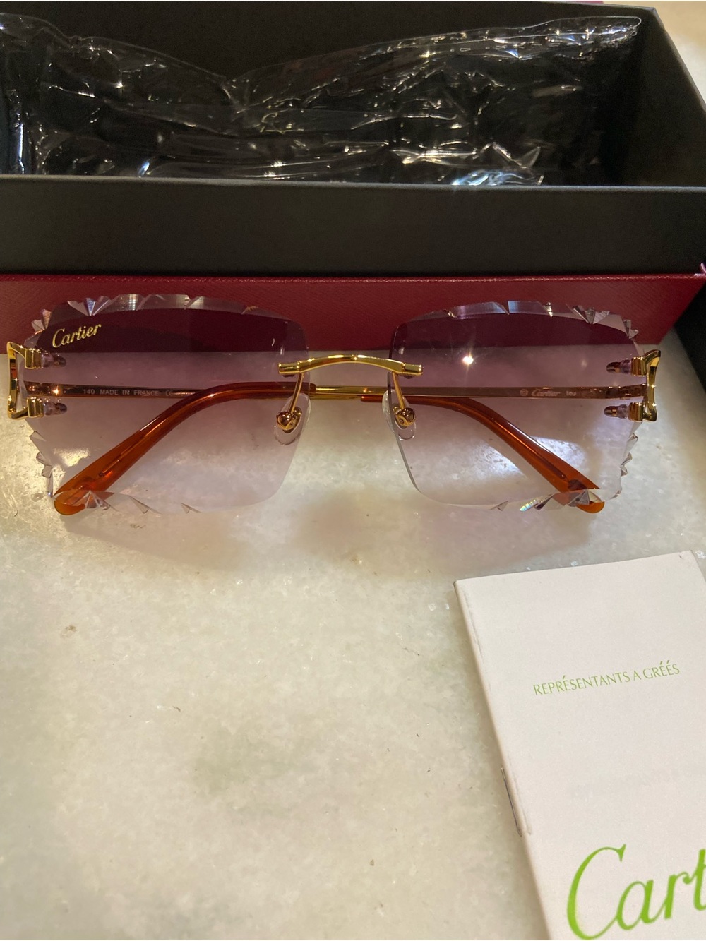 Cartier Women's Pink Gradient Rimless Sunglasses with Gold Frames